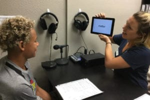 What is the Difference Between Stowell Learning Center, Sylvan, and Kumon? 1 Child reading with a tutor