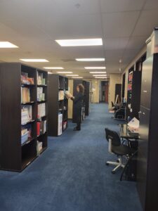 hallway lined with shelves of books with research and reference materials at Chino center