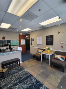 lobby with chairs and front desk at Chino center