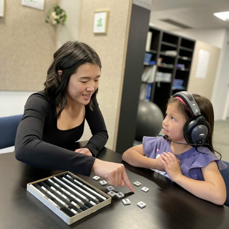 Student and clinician in an auditory training session