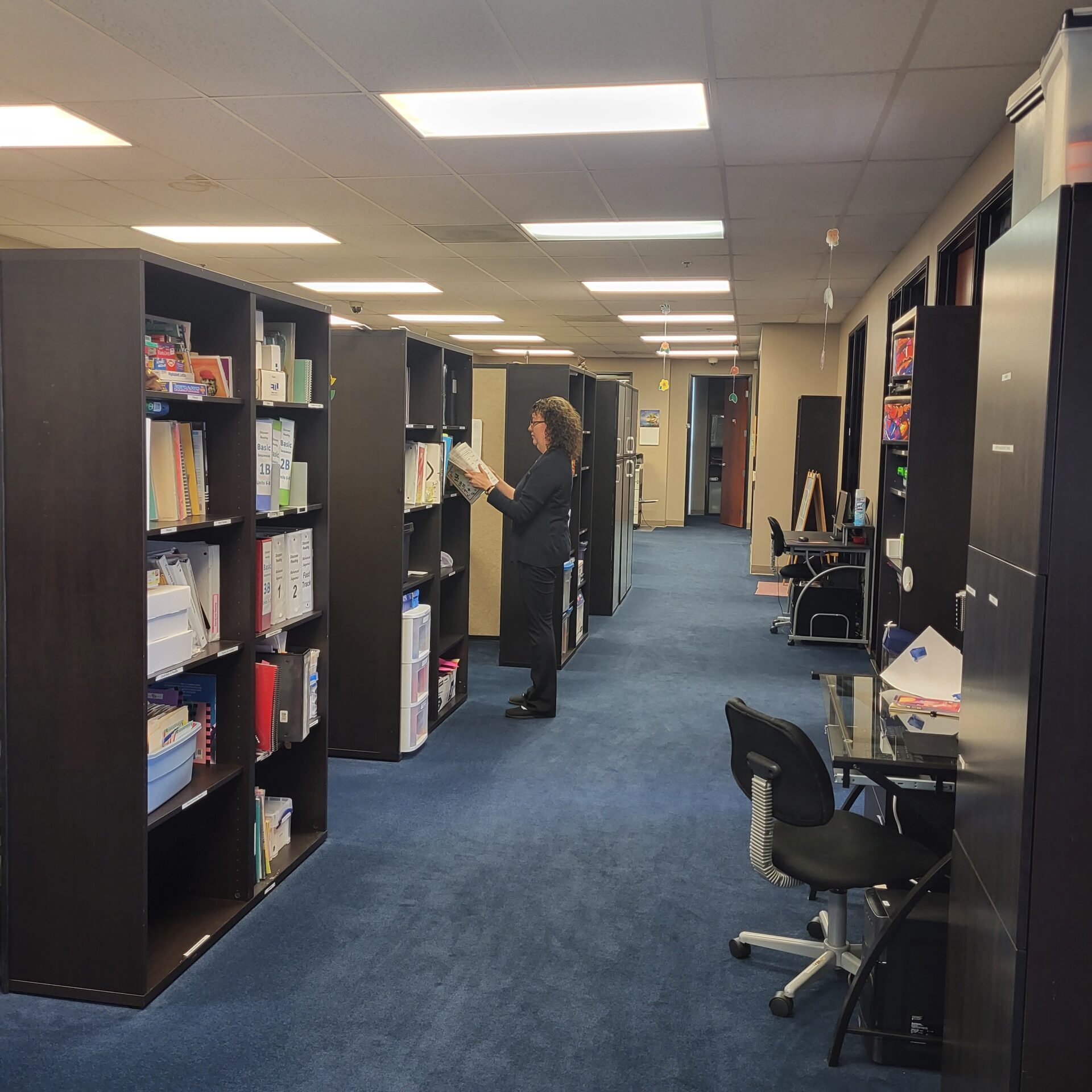 hallway lined with shelves of books with research and reference materials at Chino center