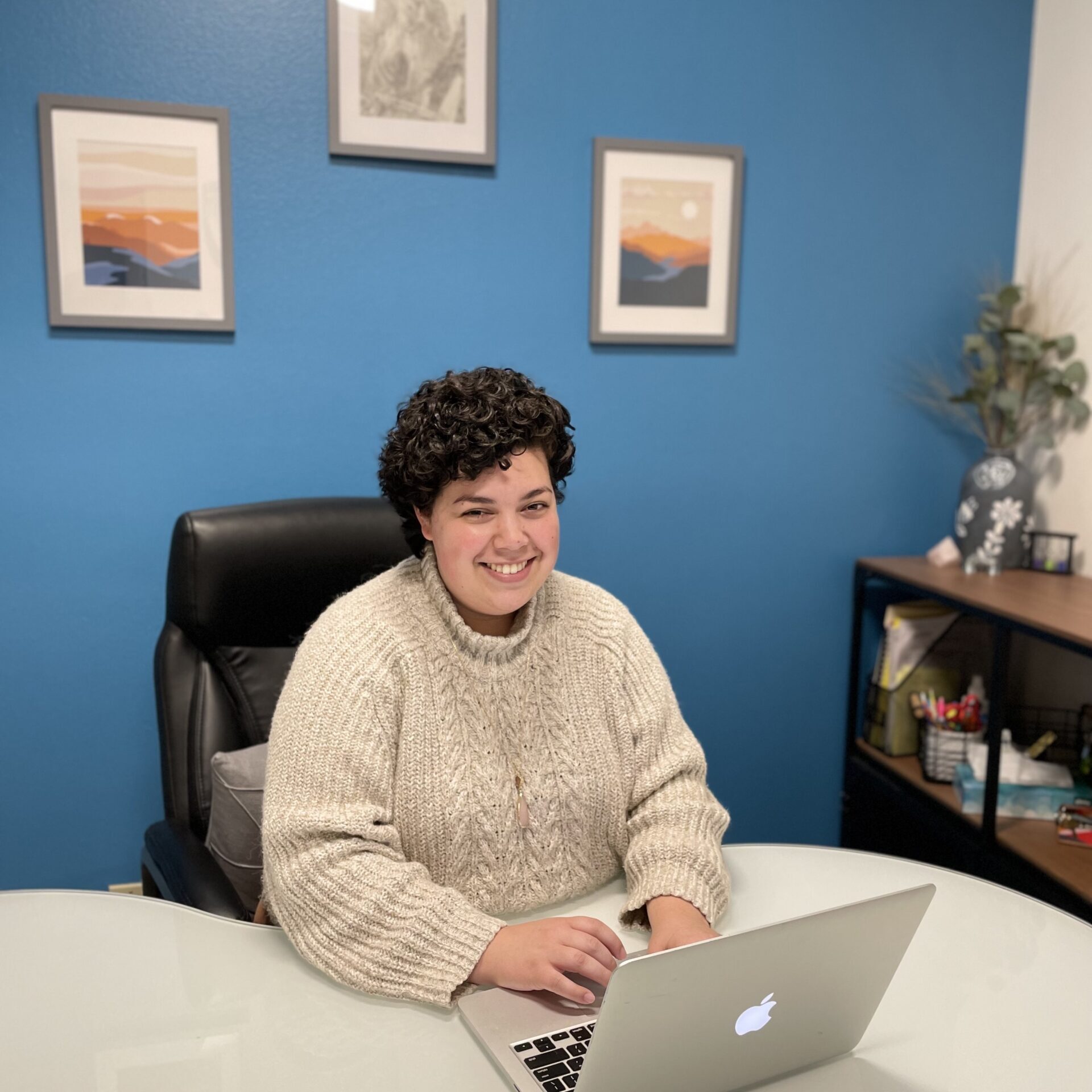 Irvine Evaluator at desk smiling