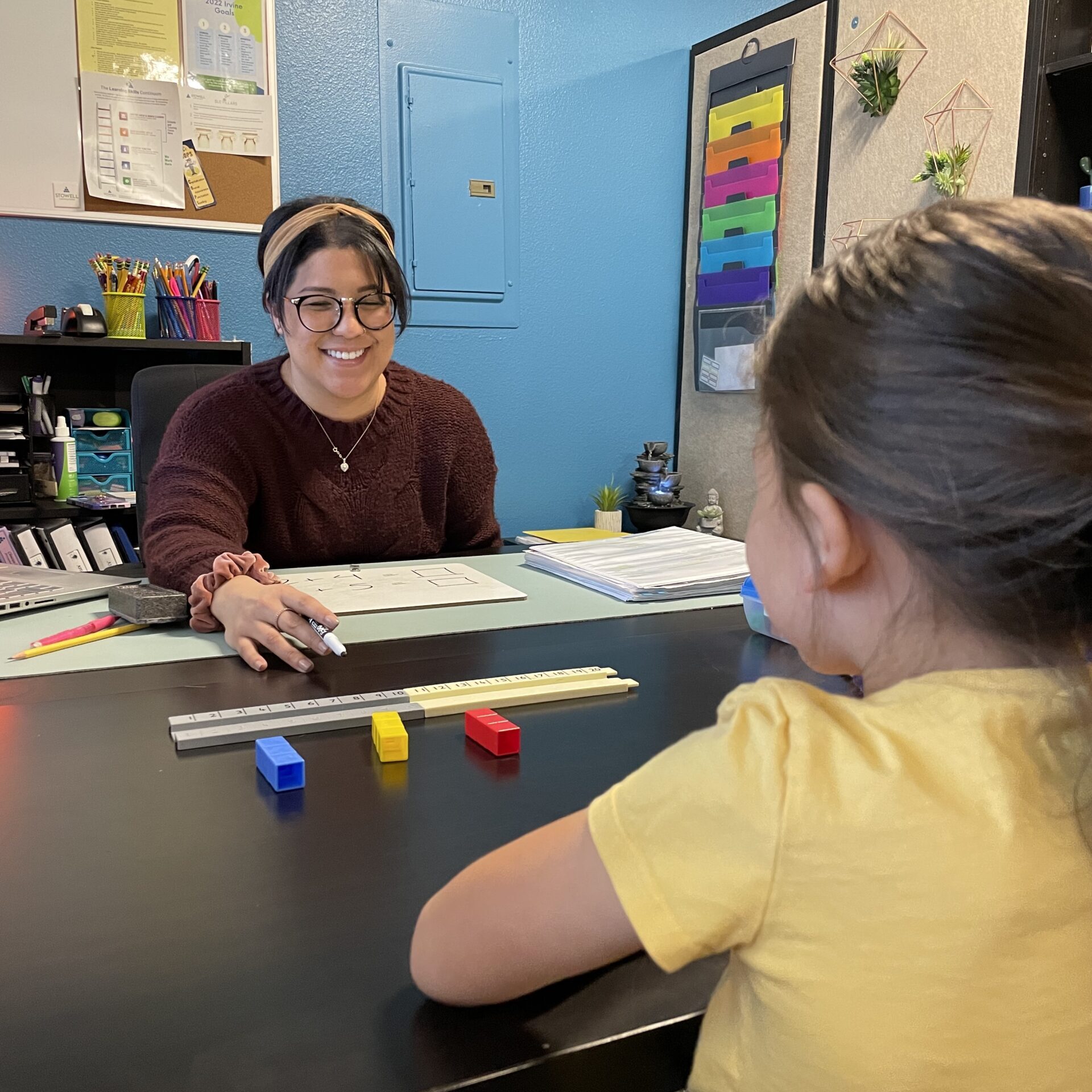 clinician in Discover Math session with color blocks in Irvine