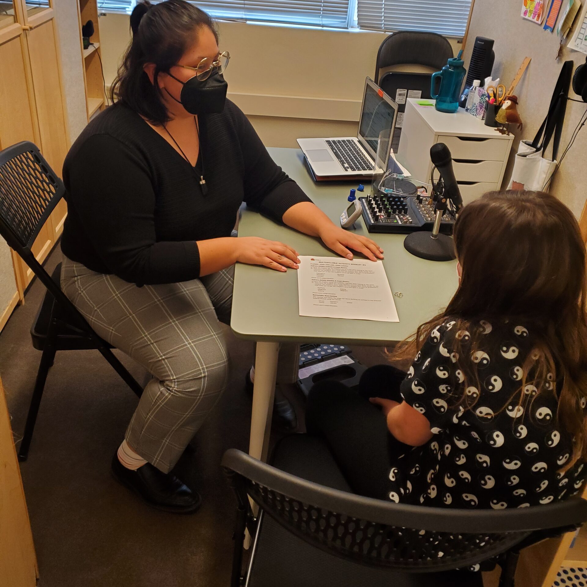 Pasadena Clinician with student at desk