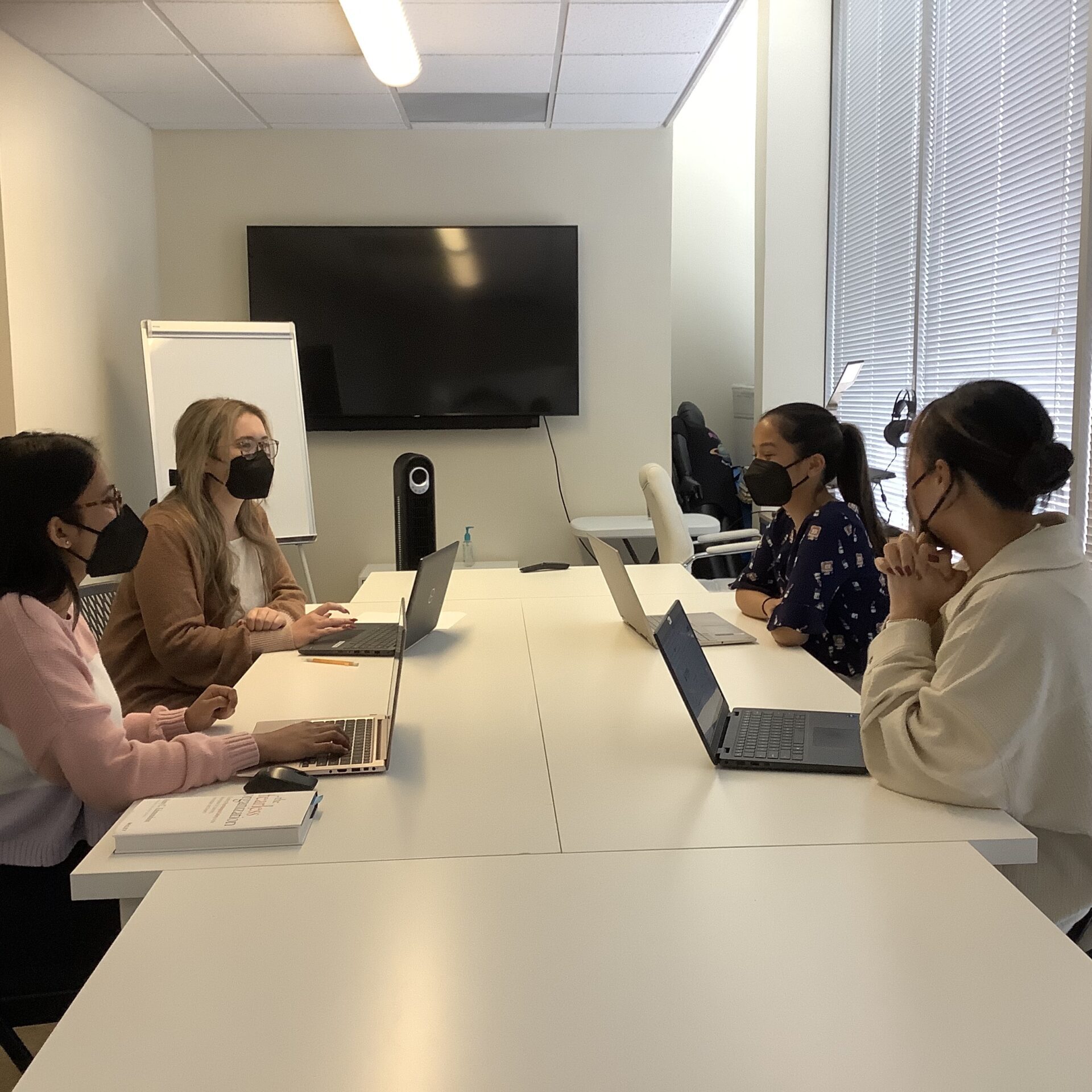 Four Pasadena clinicians in a meeting